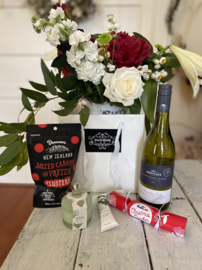Christmas giftbag - Beautiful Christmas giftbag containing a Christmas posy, bubbles, scented candle and chocolates