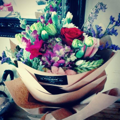 Vintage Garden - A colourful, garden-inspired bouquet combining soft pastel shades with richer pops of colour. Beautifully wrapped in natural paper, this relaxed and romantic design is perfect for celebrating any special occasion.